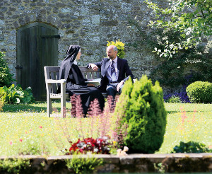 A St Augustine's College tutor talking with a nun